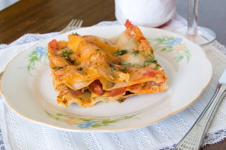 Closeup of lasagna slice on a plateの写真素材