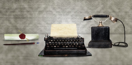 Retro communication tools - Dip pen, typewriter and vintage phoneの写真素材