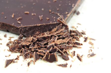 Extreme closeup of chopped chocolate pieces, isolatedの写真素材
