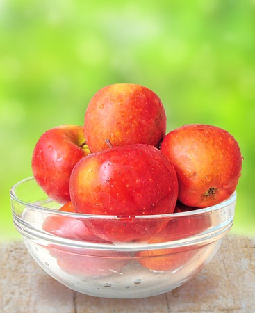 Bowl of fresh red apples on the kitchen counterの写真素材