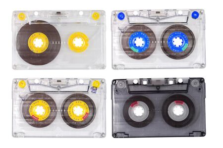Four old tape cassettes isolated on whiteの写真素材