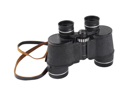 Pair of old black binoculars isolated on whiteの写真素材