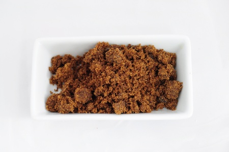 Closeup of pile of brown sugar in porcelaine bowlの写真素材