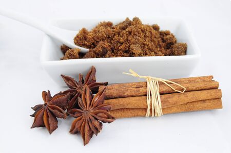Sweet ingredients - brown sugar, cinnamon sticks and aniseの写真素材