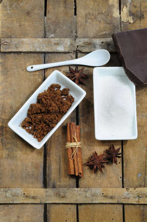Sweet ingredients - white and brown sugar, chocolate, cinnamon and aniseの写真素材