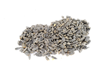 Roasted salted black sunflower seed isolated on whiteの写真素材