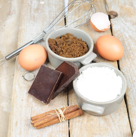 Ingredients for cake - flour, brown sugar, eggs, cinnamon, chocolateの写真素材