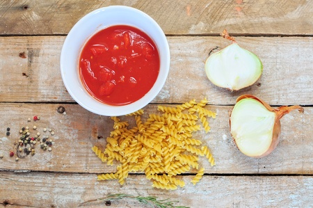 Ingredients for pasta - fusili, tomato sauce and onionの写真素材
