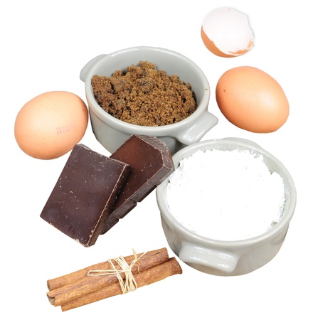 Ingredients for cake - flour, brown sugar, eggs, cinnamon, chocolate, isolatedの写真素材