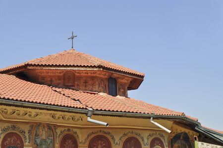 Roof of christian orthodox monastery with crossの写真素材