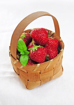 Basket full of fresh juicy strawberriesの写真素材