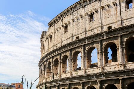 Close up of the Colosseum in Rome in Italy on a Sunny day against a blue skyの写真素材