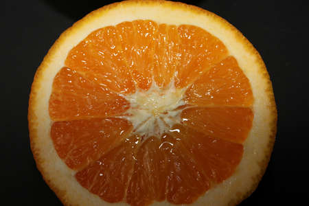 Grapefruit, orange, lemon and lime isolated on a black background. Citrus fruits in the section....