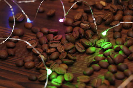 Coffee cup and coffee beans isolated on black background