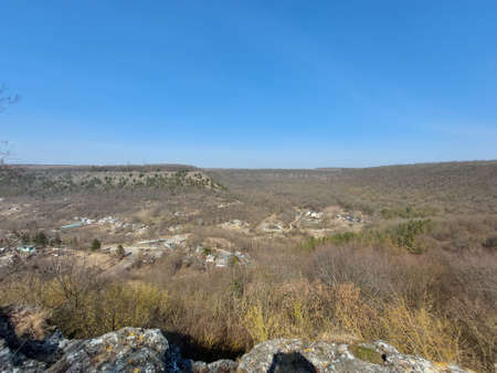 Beautiful view of the rocky terrain. Large stones covered with moss and various vegetationの写真素材