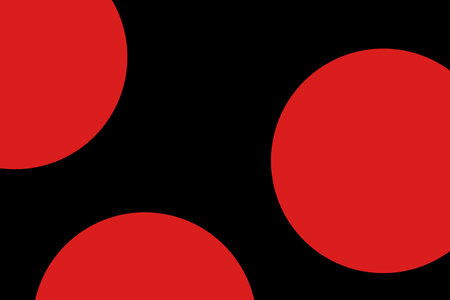 Red circles and triangles isolated on a black background. Randomly placed geometric shapesの写真素材