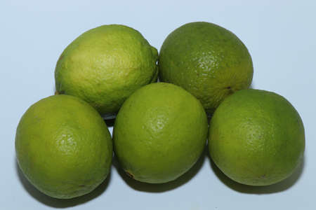 Yellow and green juicy lemons and limes isolated on a white background. healthy eating. Delicious...