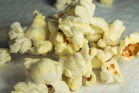 Air popcorn in a shot glass on a white background