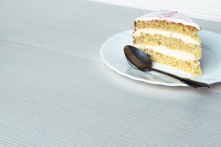 A slice of vanilla biscuit and white cream cake. Close-upの写真素材