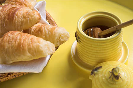 croissants and honeyの写真素材