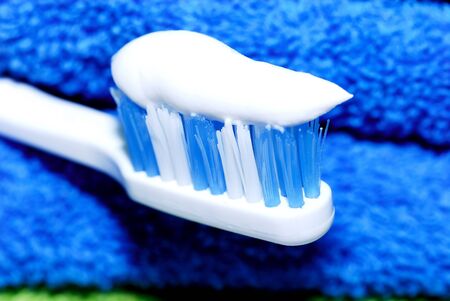 tooth-paste on a toothbrush close-up