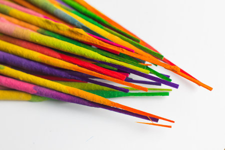 Colorful incense sticks isolated on white background with copy space.の写真素材