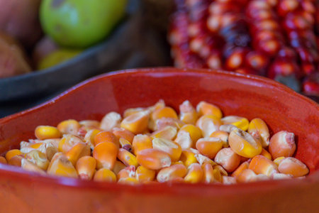 Corn seeds in a bowl, closeup of photo with selective focusの写真素材