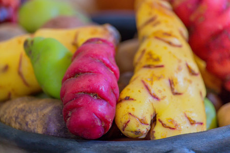 Fruits and vegetables in a wooden bowl on the table close upの写真素材
