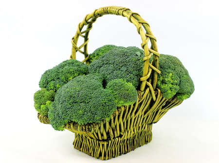 Fresh broccoli in basket on white backgroundの写真素材