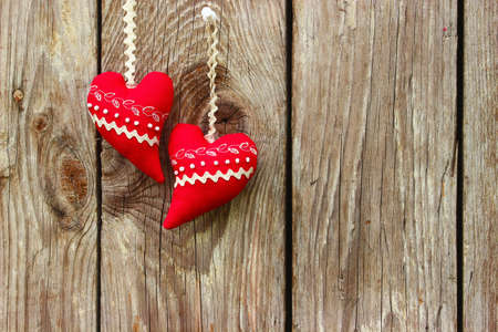 Red hearts on a wooden backgroundの写真素材