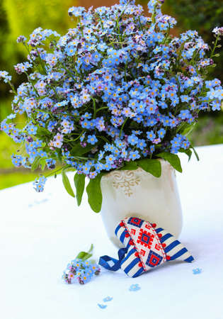 Bouquet of forget-me-nots on a white backgroundの写真素材