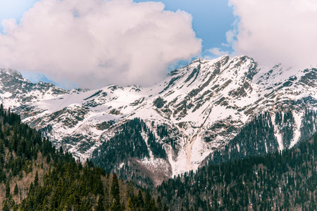 Landscape of snowy mountains, mountain range in haze winter