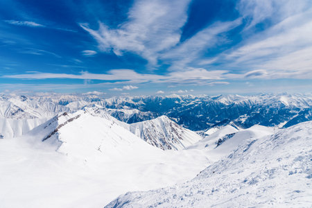 Landscape of snowy mountains, mountain range in haze winter