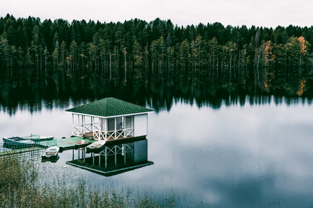 Landscape of blue lake deep in the light of the sun in the daytime, clouds in the skyの写真素材