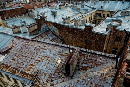 Roofs of multi storey residential buildings in the city, houses real estate, bird's eye viewの写真素材