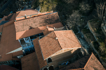 Aerial view of residential buildings with terracotta tiled rooftops