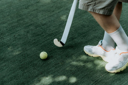 Field hockey amateur competition, kids teens playing sports outside, ball and sticks