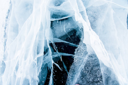 Deep blue ice texture, lake water frozen in winter