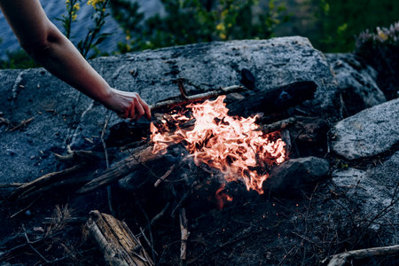Campfire at the tourist campsite, hiking tourism on weekend vacation, fire flame