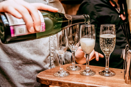 Glass glasses of champagne, people celebrating an important event, a festive toastの写真素材