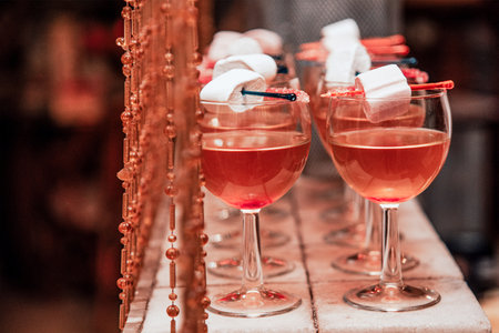 Alcoholic cocktail in a glass wineglass, nightlife in a club bar, bartender mixed liquidの写真素材