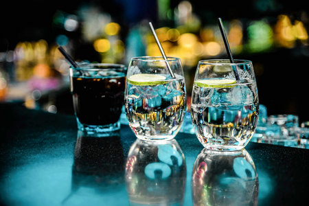 Alcoholic cocktail in a glass wineglass, nightlife in a club bar, bartender mixed liquidの写真素材