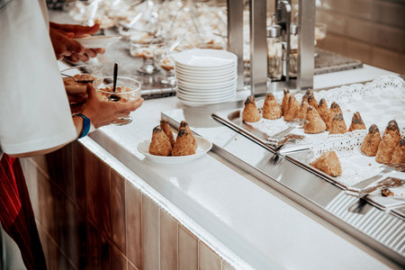 Sweet desserts are on the table in the hotel restaurant, the cafe dining room sells various delicaciesの写真素材