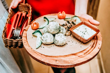 Italian dish in glass plate on wooden table cheese ball lunch in restaurant
