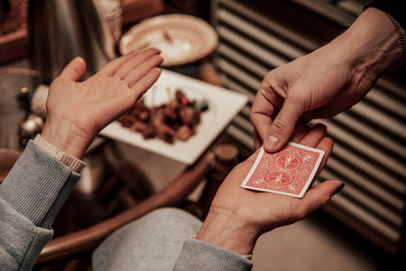 Close up of hands performing card tricks and entertainment