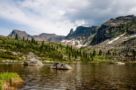 Landscape of Siberia Ergaki mountains, mountain range in haze in summerの写真素材