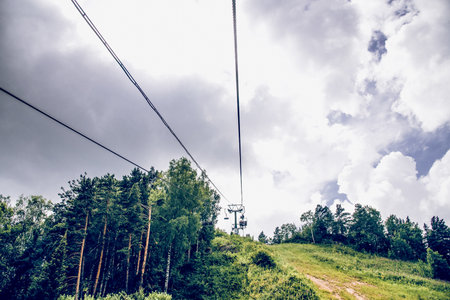 Landscape of snowy Siberia mountains, mountain range in haze in summerの写真素材