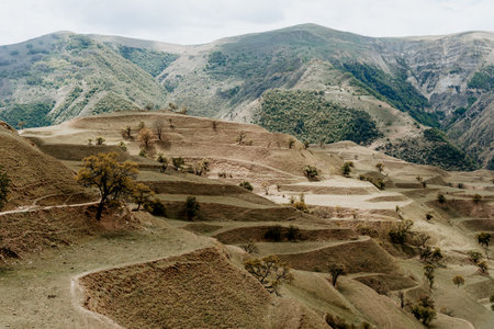 Landscape of Dagestan mountains, mountain range in haze in summerの写真素材
