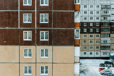 Multi storey residential building in suburb of the city, a house against the background of a sunny summer dayの写真素材
