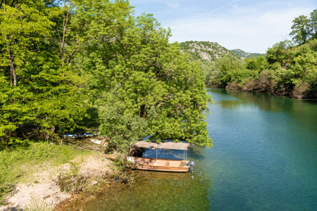 The Crnojevica River flows into Lake Skadar, summer mountains Montenegro landscapeの写真素材